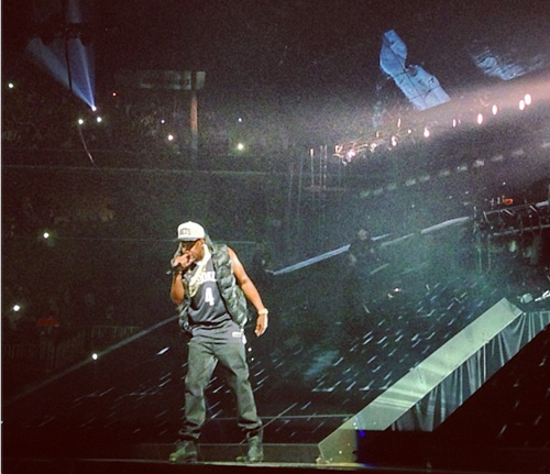 Jay-Z wearing the new Brooklyn Nets jersey onstage at the Barclays Center