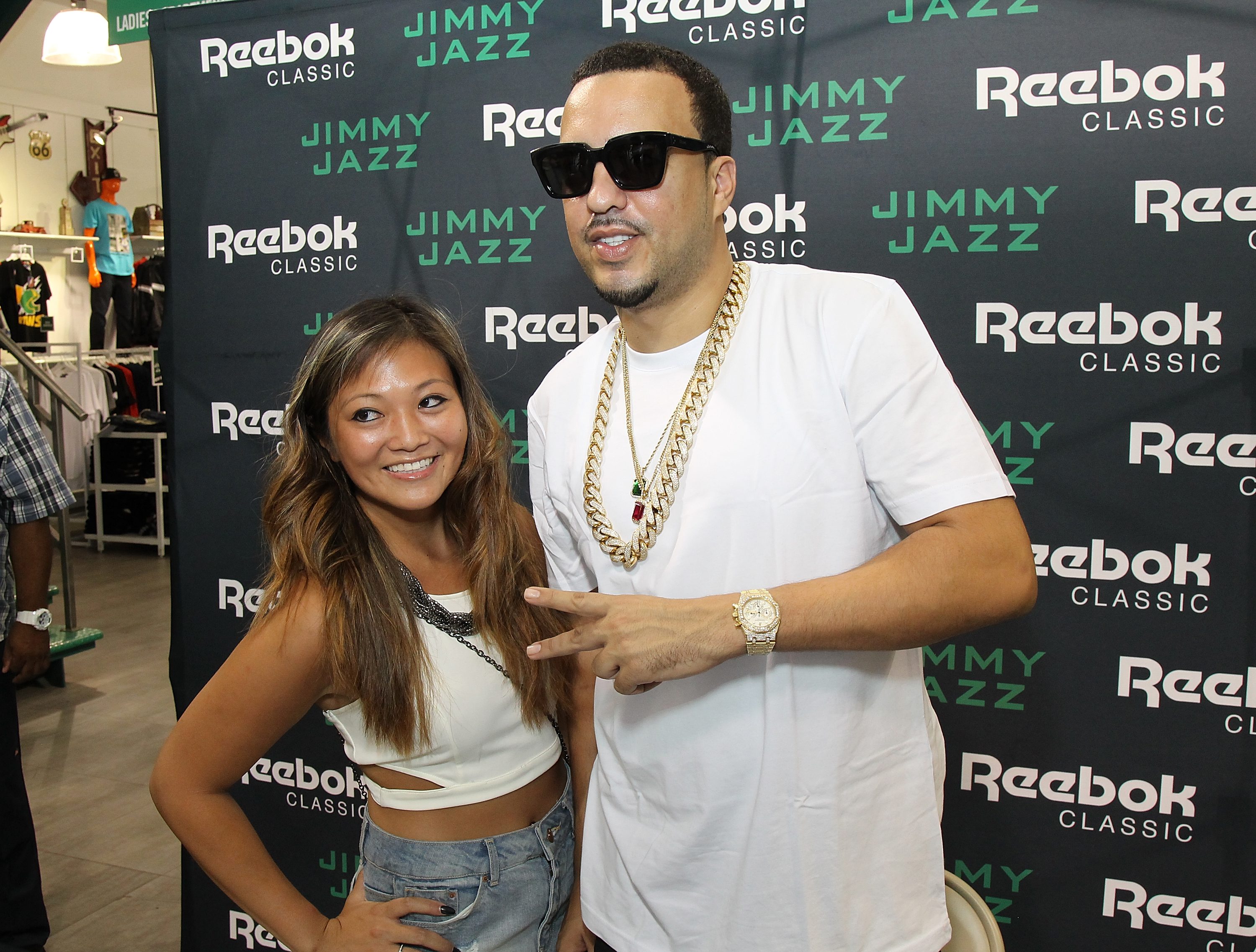 NEW YORK, NY - AUGUST 30:  French Montana poses with a fan during the Launch of the Ventilator ST at Jimmy Jazz in Harlem on August 30, 2015 in New York City.  (Photo by Bennett Raglin/Getty Images for Reebok)